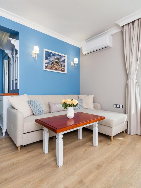 a living room with a couch and a table at Casa Dolce far niente , in Blue, PARKING in Sofia