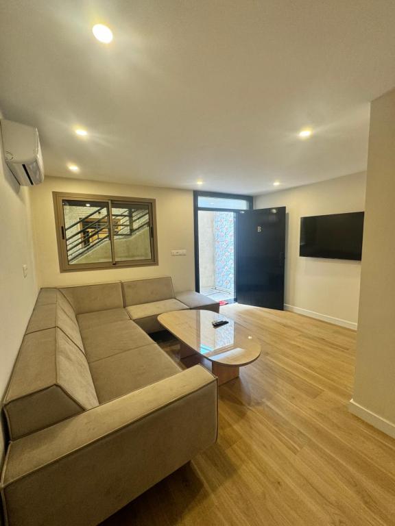 TV a/nebo společenská místnost v ubytování belle vue appartement al hoceima