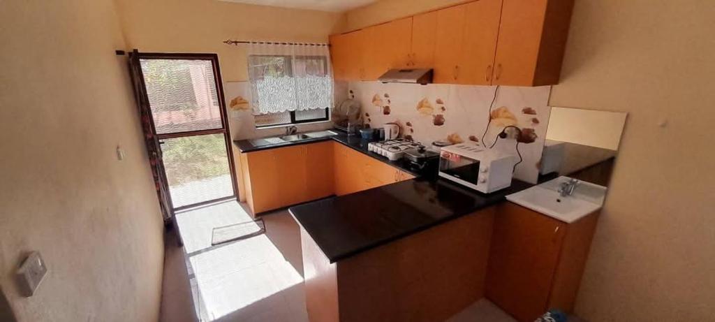 Kuchyň nebo kuchyňský kout v ubytování Hasmatullah Holiday Apartments