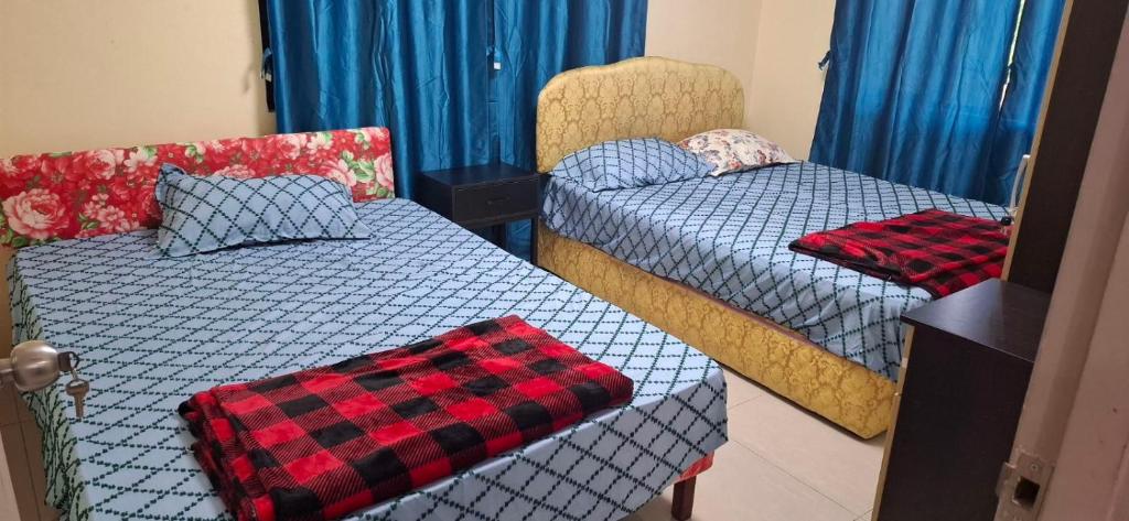 Postel nebo postele na pokoji v ubytování Hasmatullah Holiday Apartments
