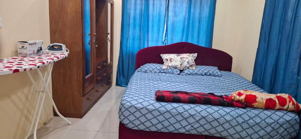 Postel nebo postele na pokoji v ubytování Hasmatullah Holiday Apartments