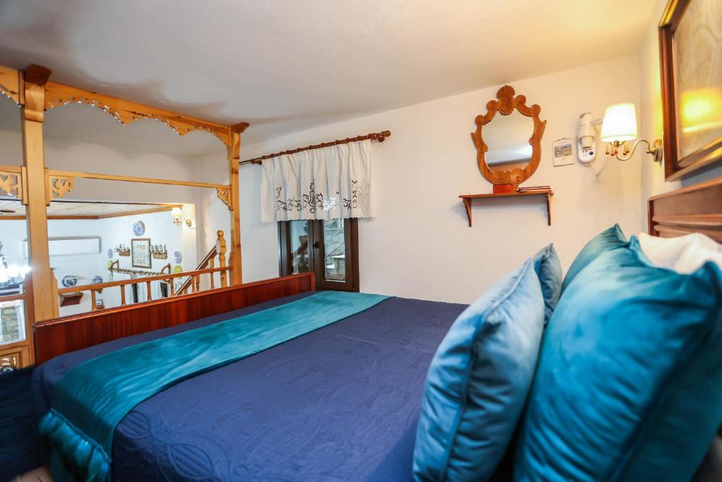 Postel nebo postele na pokoji v ubytování Skyrian Living