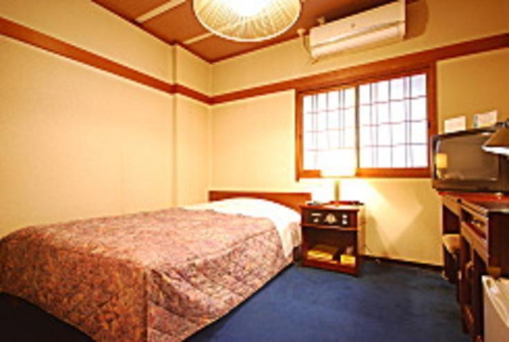 Krevet ili kreveti u jedinici u objektu Royal Hotel