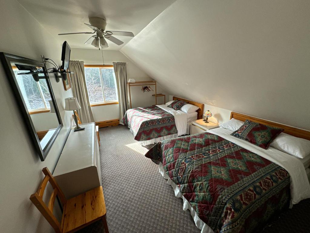 Postel nebo postele na pokoji v ubytování Xenia Lodge