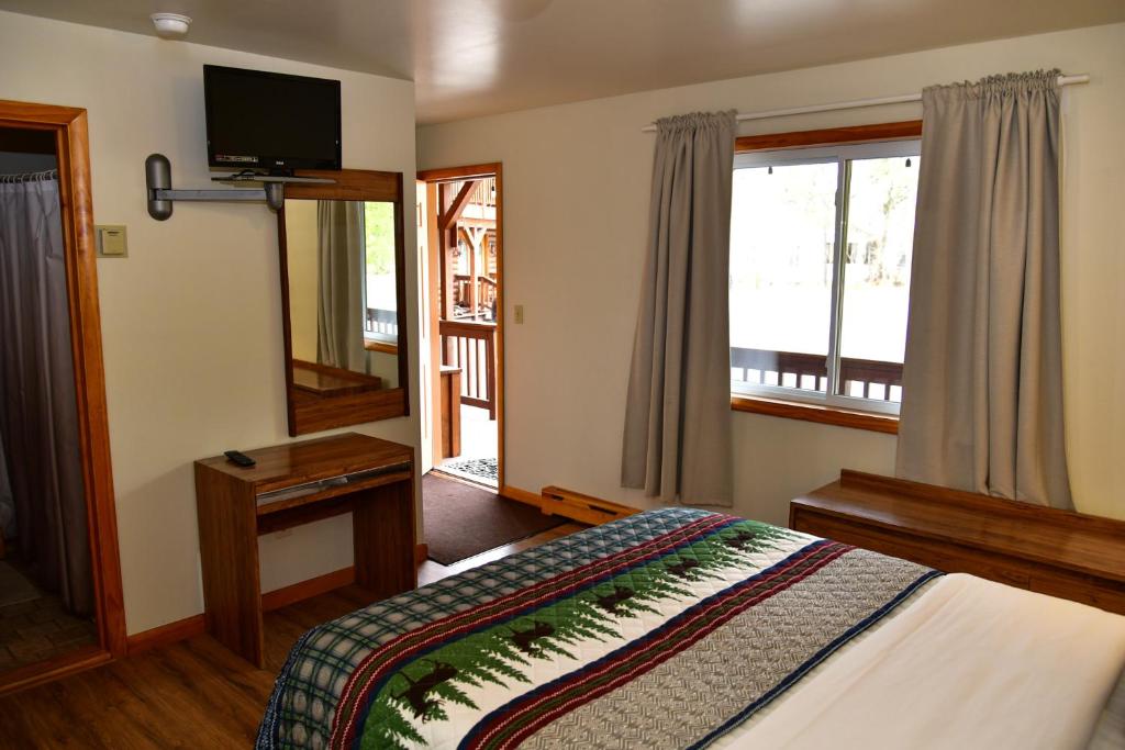 Postel nebo postele na pokoji v ubytování Xenia Lodge