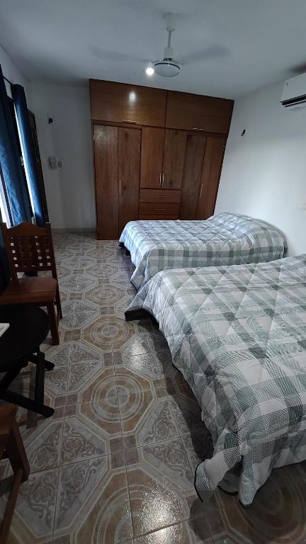 Postel nebo postele na pokoji v ubytování Habitacion Codice Maya 1