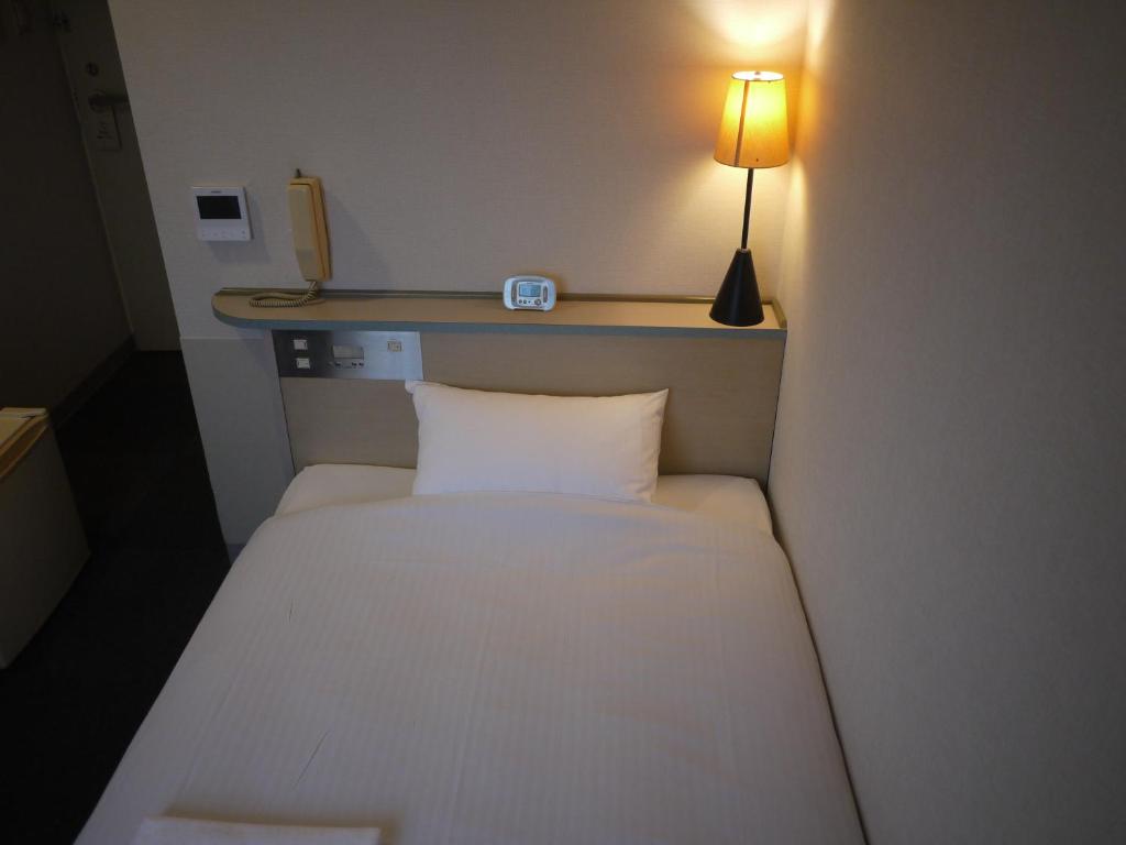 Postel nebo postele na pokoji v ubytování Hotel Kokomo
