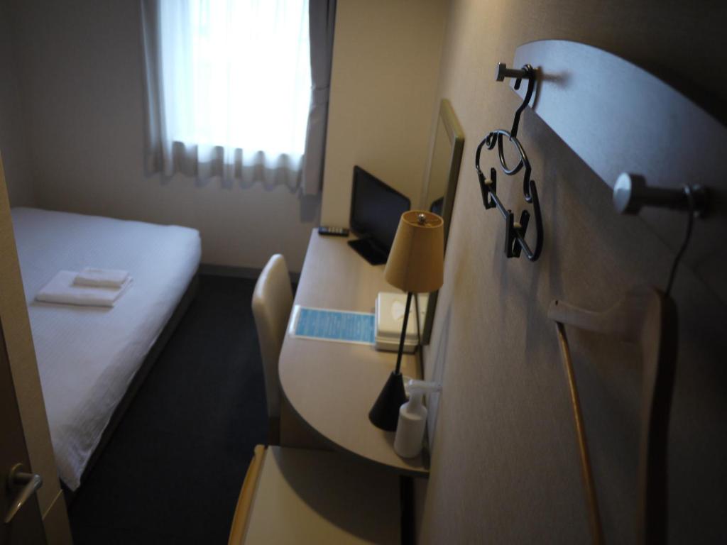 Postel nebo postele na pokoji v ubytování Hotel Kokomo