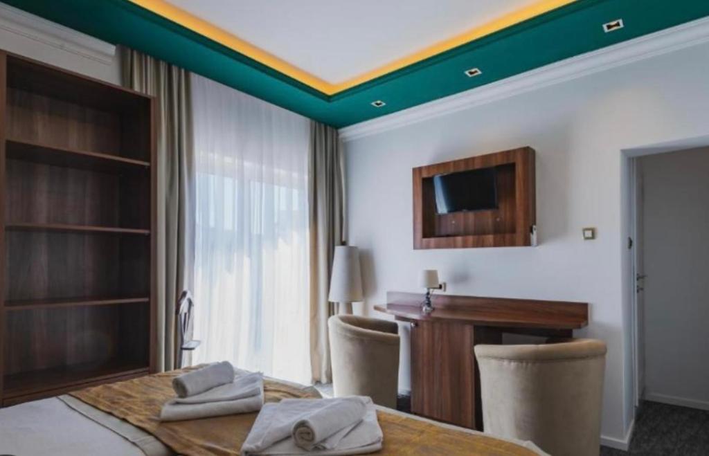 Postel nebo postele na pokoji v ubytování Hotel Garni Ideal