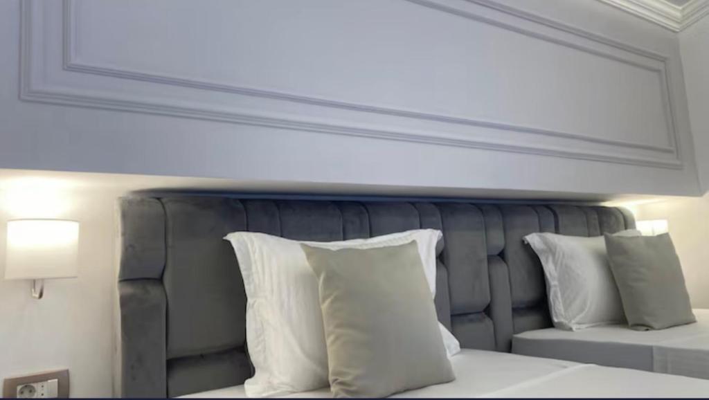 Postel nebo postele na pokoji v ubytování Hotel Garni Ideal