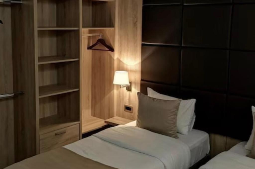 Postel nebo postele na pokoji v ubytování Hotel Garni Ideal
