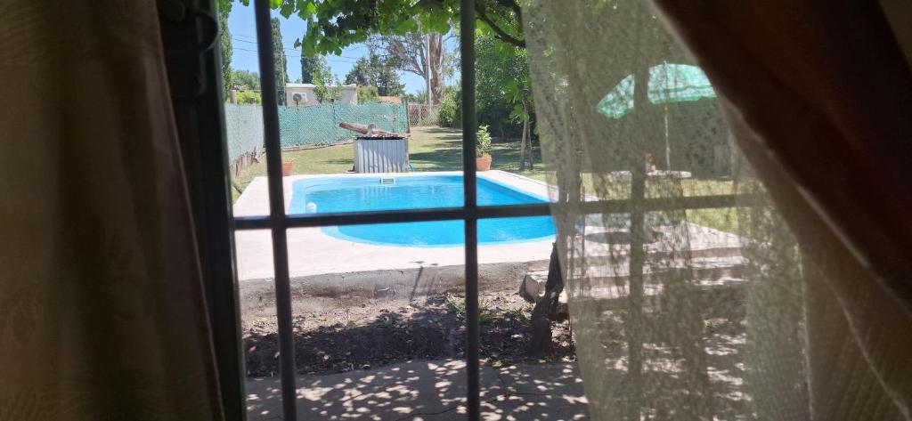 a view of a swimming pool from a window at Casa Luna in Parana