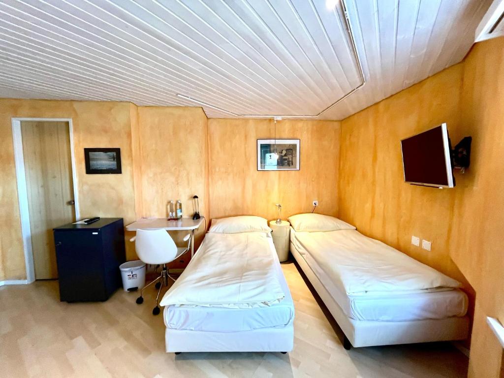 Postel nebo postele na pokoji v ubytování Seiler's Hotel