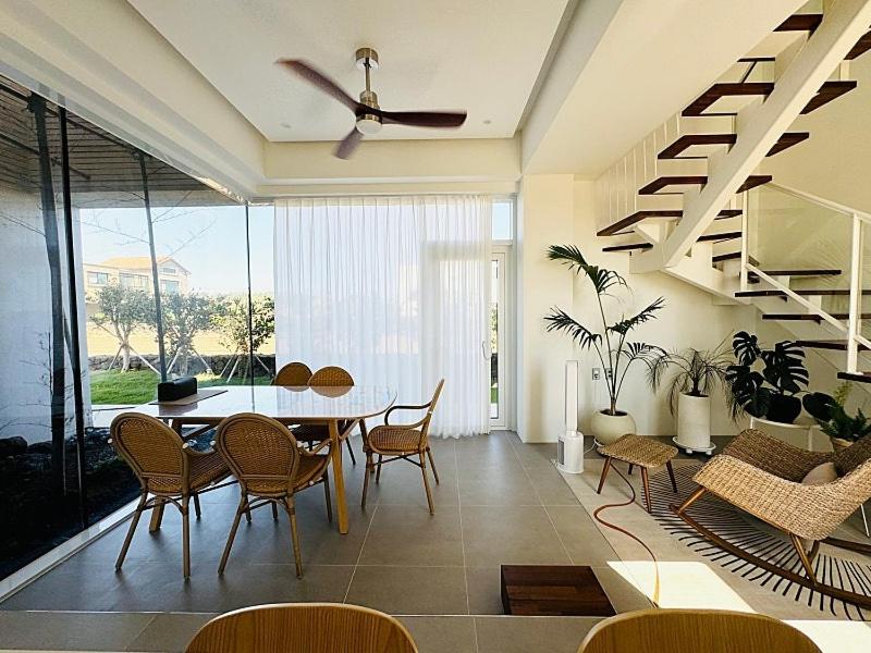 a dining room with a table and chairs at Oceanview,Villa de 427 in Seogwipo
