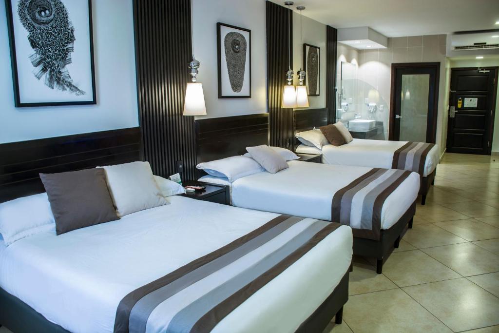 Voodi või voodid majutusasutuse Hotel Las Cascadas toas