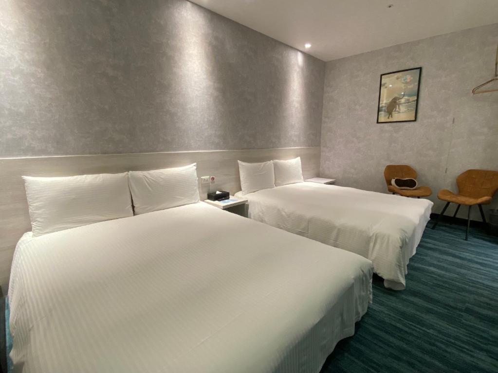 Katil atau katil-katil dalam bilik di 西門雲町旅店 Sky Gate Hotel
