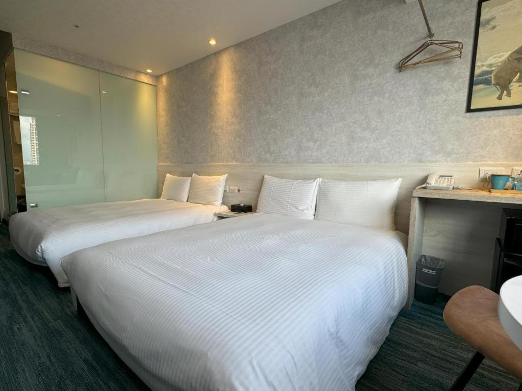 Katil atau katil-katil dalam bilik di 西門雲町旅店 Sky Gate Hotel