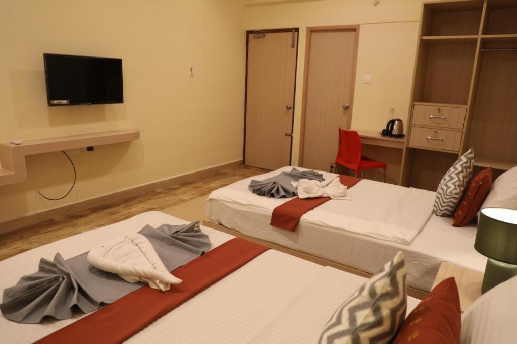 Postel nebo postele na pokoji v ubytování Hotel Green parrot