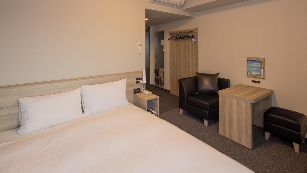 Postel nebo postele na pokoji v ubytování Hotel Route Inn Imizu
