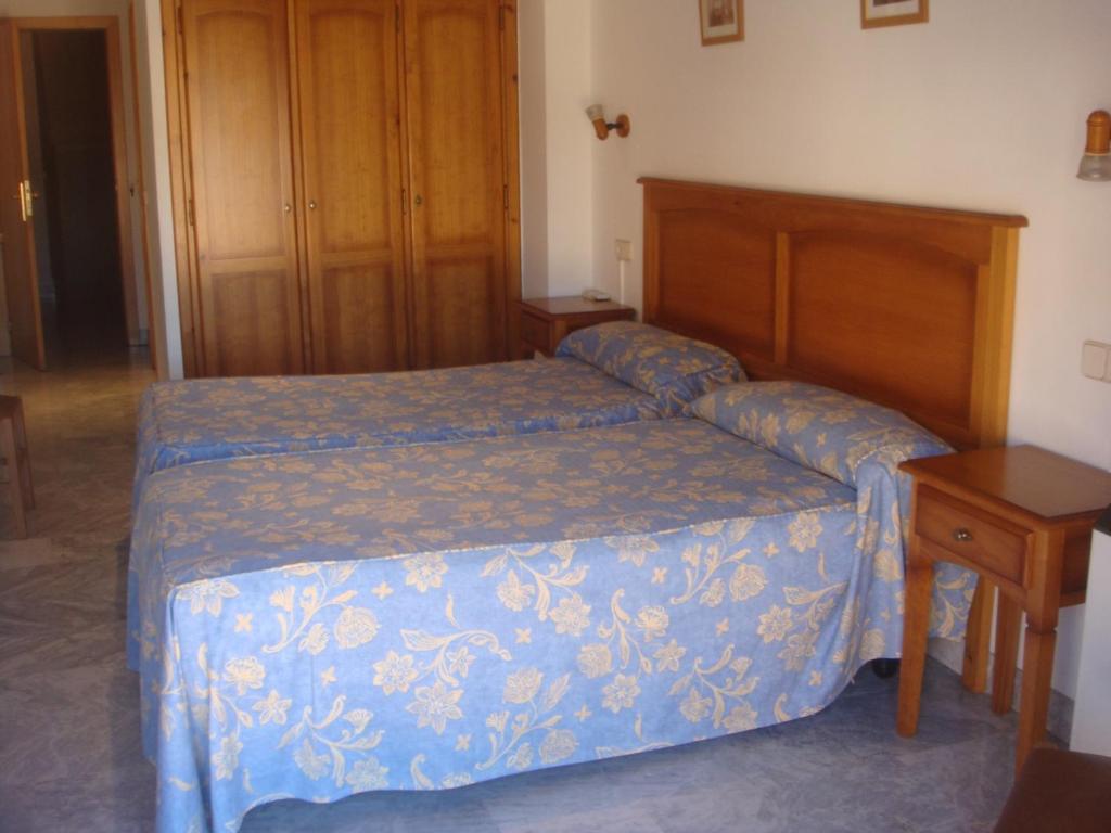 Postel nebo postele na pokoji v ubytování Hostal Acuario