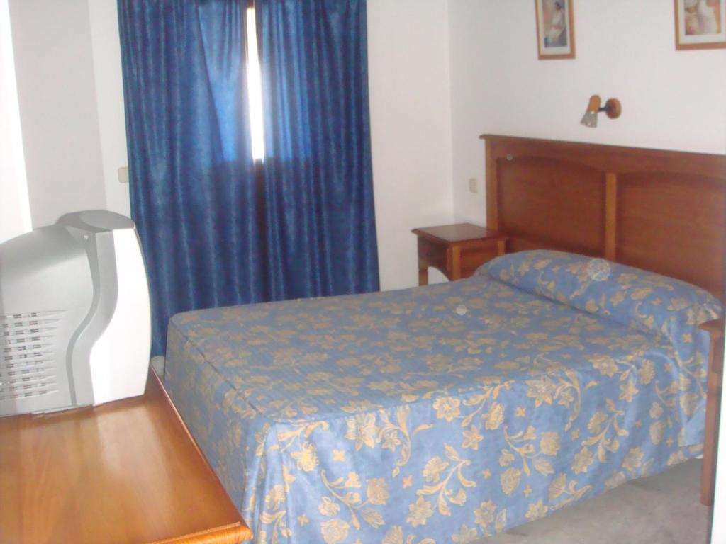 Postel nebo postele na pokoji v ubytování Hostal Acuario