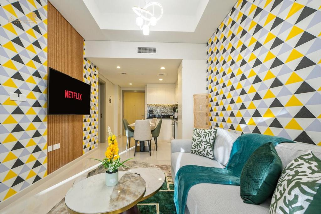 a living room with a couch and a table at Elegant Sunset View 3BHK 7pax in Dubai