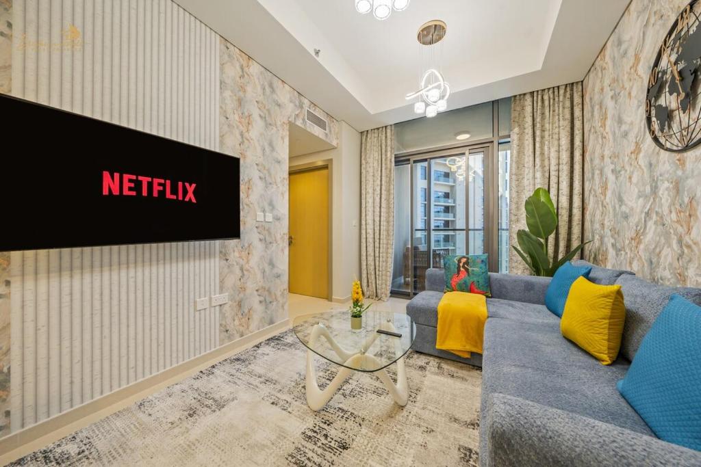 a living room with a couch and a tv at Classic Canal View 2 Bhk 6pax in Dubai