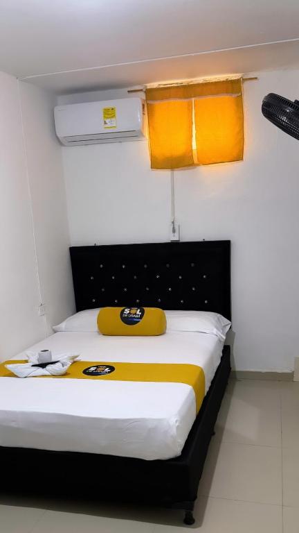 Postel nebo postele na pokoji v ubytování Hotel sol de uraba