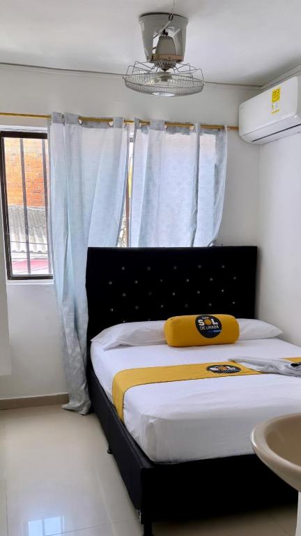 Postel nebo postele na pokoji v ubytování Hotel sol de uraba
