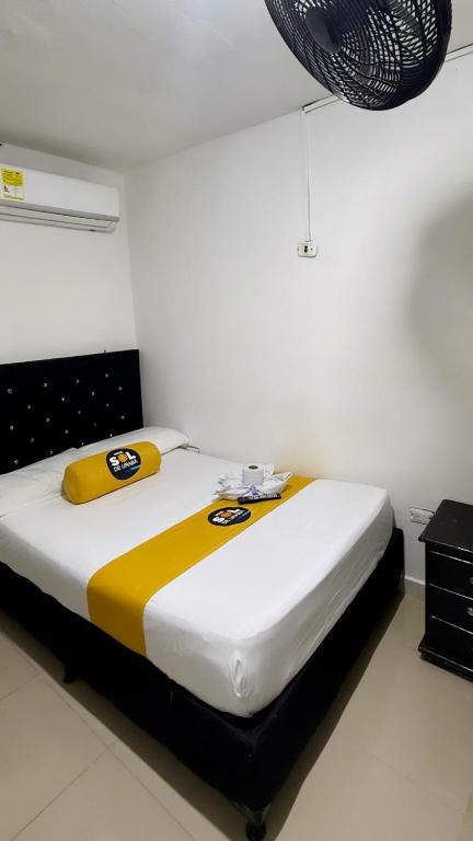 Postel nebo postele na pokoji v ubytování Hotel sol de uraba