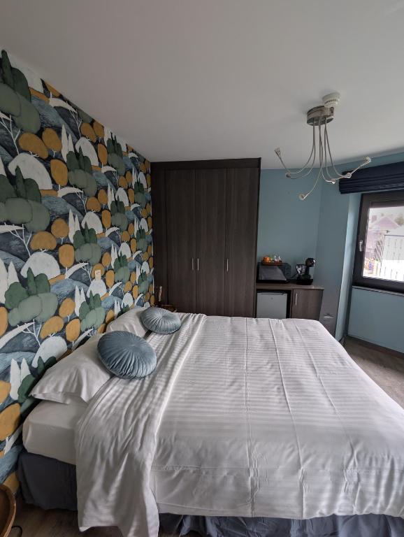 Postel nebo postele na pokoji v ubytování A Fleur de Couette