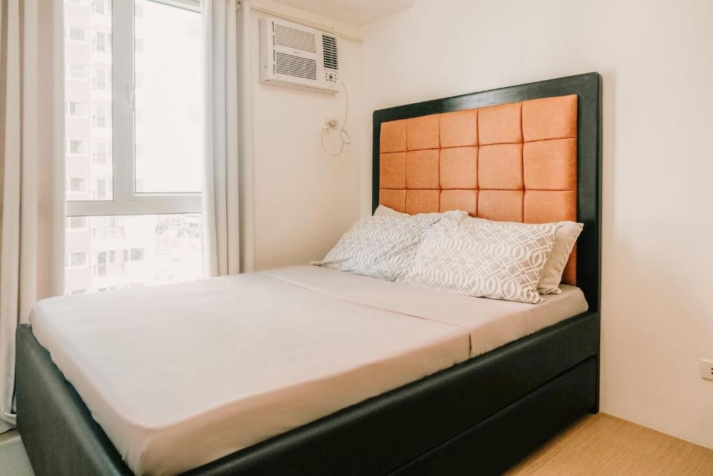 En eller flere senge i et værelse på City Haven with Prime Views