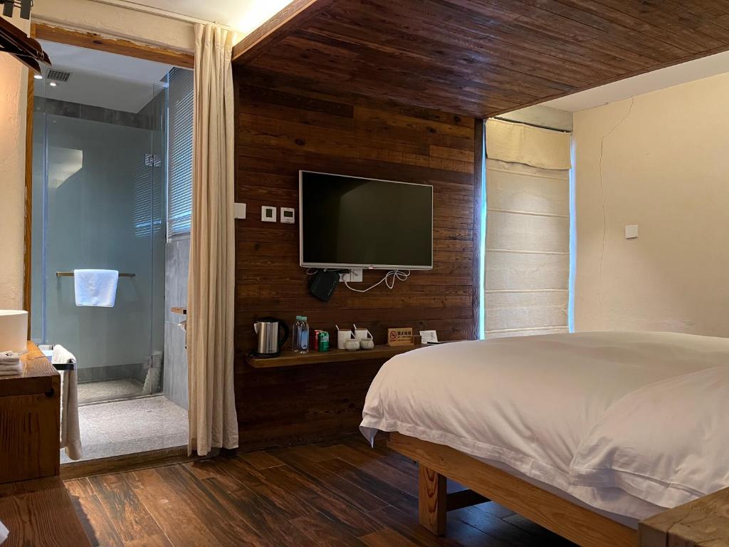 Postel nebo postele na pokoji v ubytování Huangshan Shanshui Boutique Hotel Liyang Scenic Area
