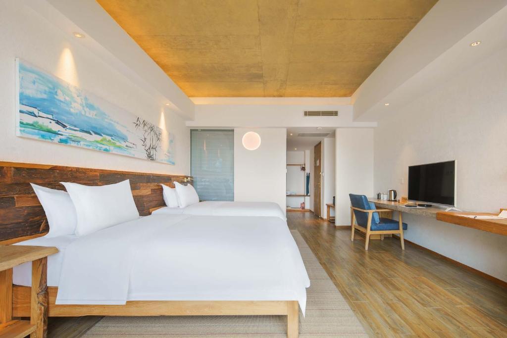 Postel nebo postele na pokoji v ubytování Huangshan Shanshui Boutique Hotel Liyang Scenic Area