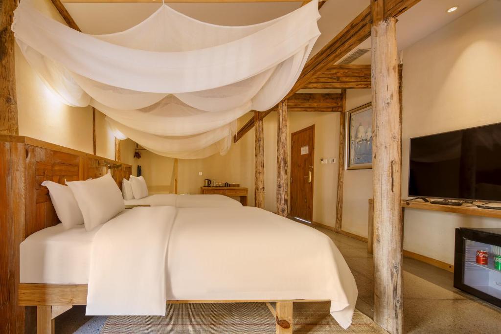 TV a/nebo společenská místnost v ubytování Huangshan Shanshui Boutique Hotel Liyang Scenic Area