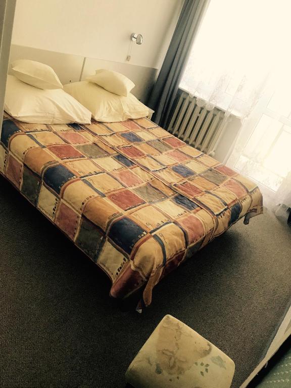 Postel nebo postele na pokoji v ubytování Geovita Dąbki