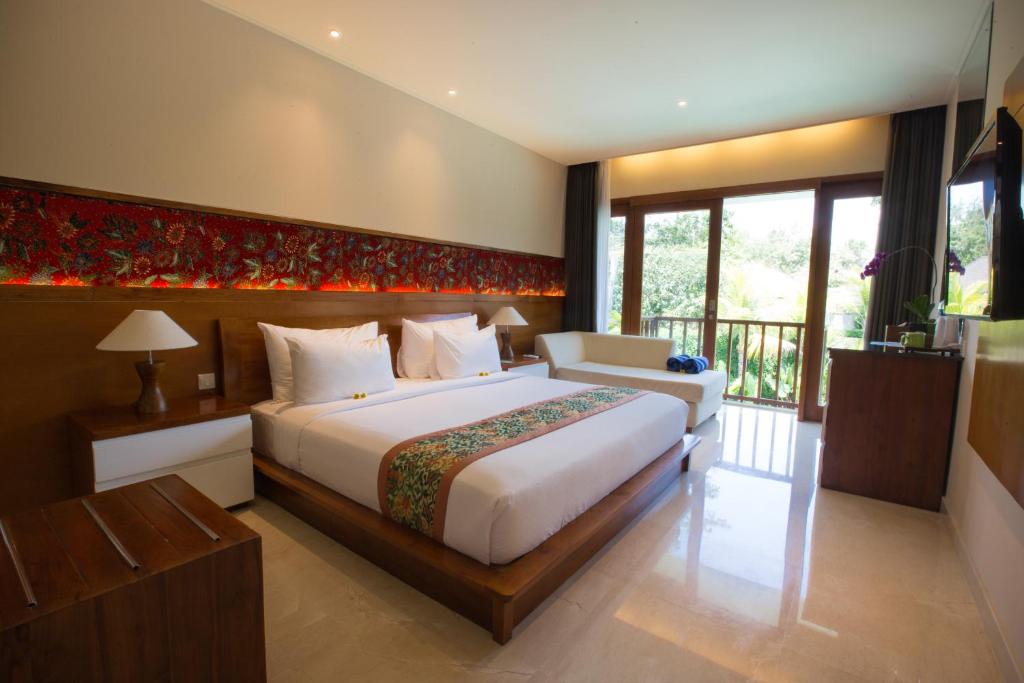 Postel nebo postele na pokoji v ubytování Ubud Wana Resort