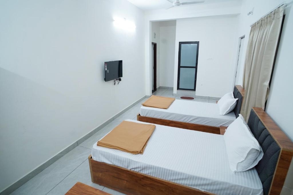 Postel nebo postele na pokoji v ubytování Hotel Pb Inn