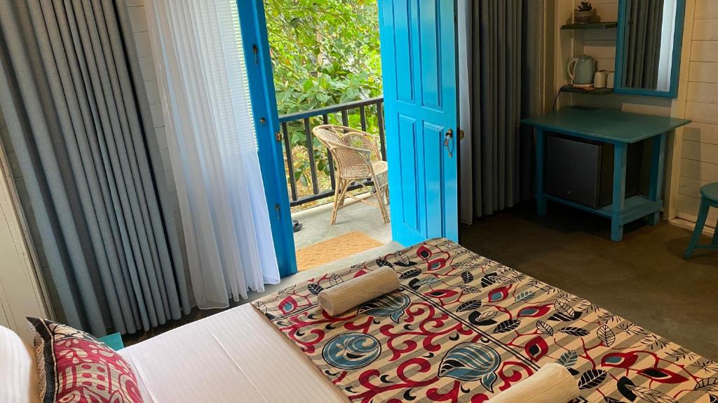 Postel nebo postele na pokoji v ubytování Mahaon surf hotel
