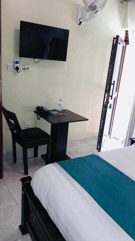 Postel nebo postele na pokoji v ubytování BWIRANDA HOTEL