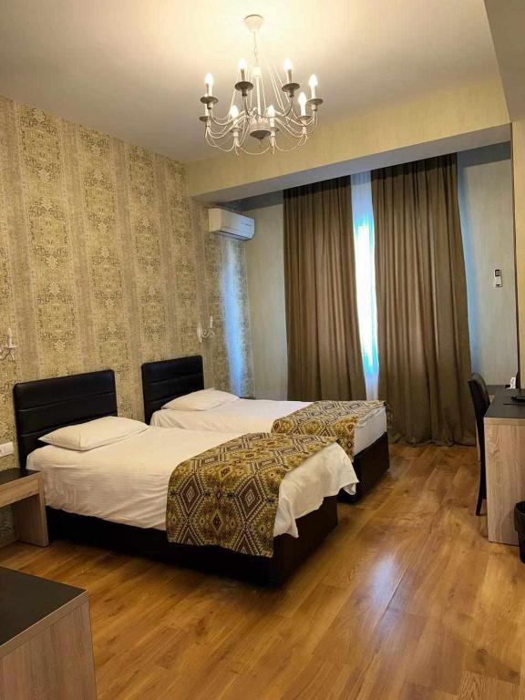 Postel nebo postele na pokoji v ubytování Hotel Diamond