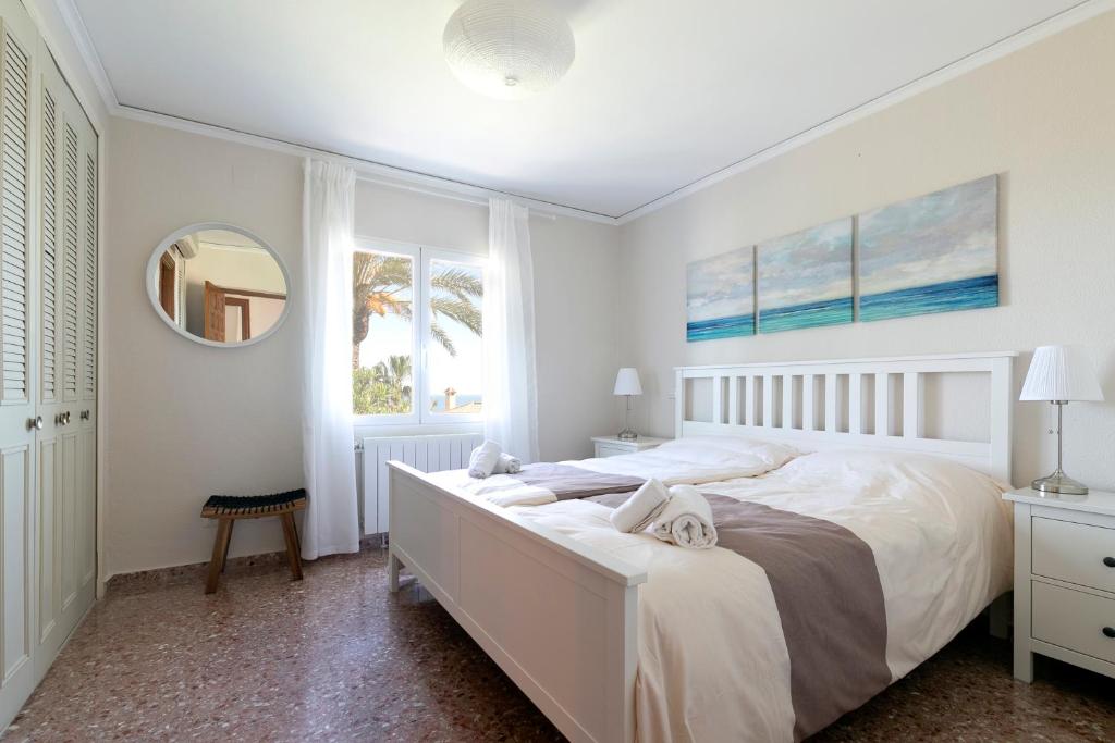 Postel nebo postele na pokoji v ubytování Villa Montgo Denia
