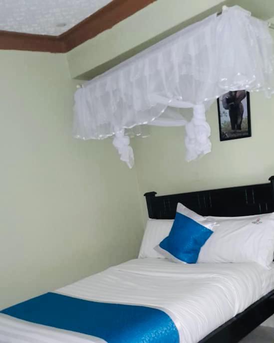 Postel nebo postele na pokoji v ubytování BWIRANDA HOTEL