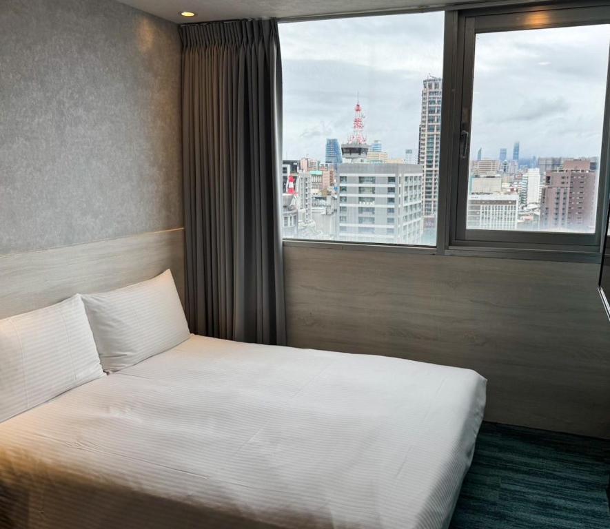 Katil atau katil-katil dalam bilik di 西門雲町旅店 Sky Gate Hotel