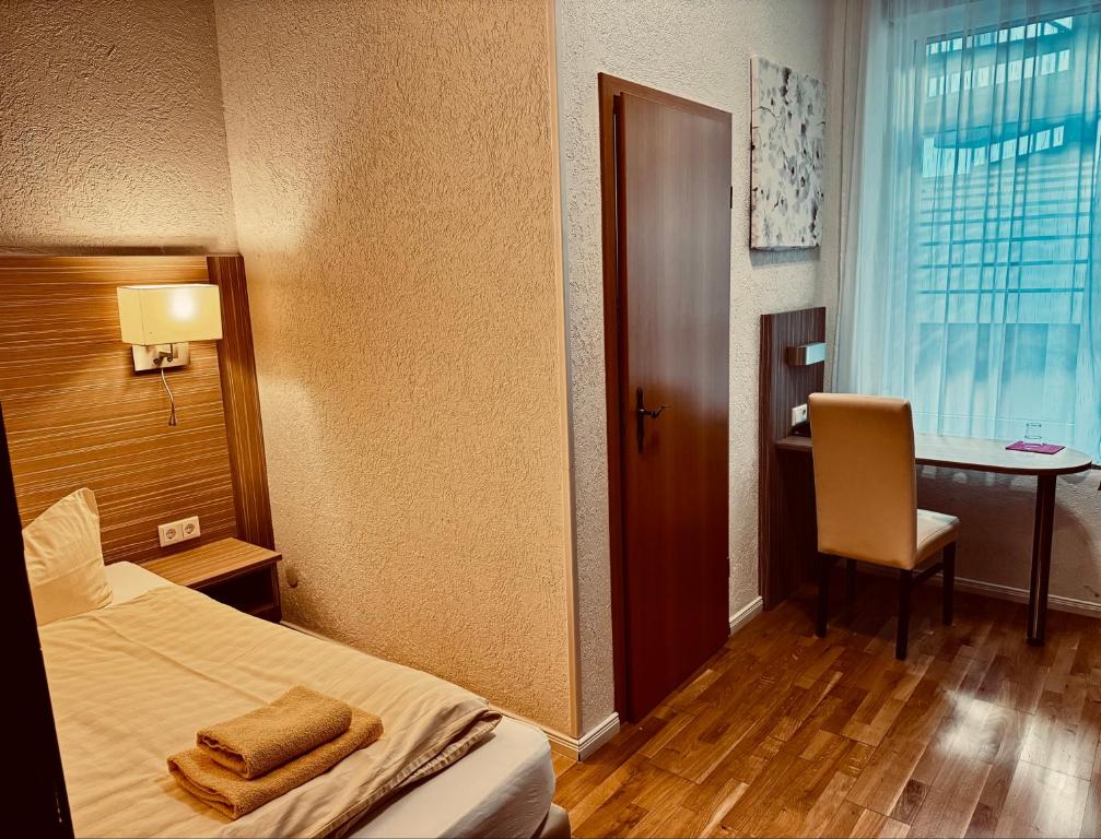 Postel nebo postele na pokoji v ubytování Hotel Goldener Anker