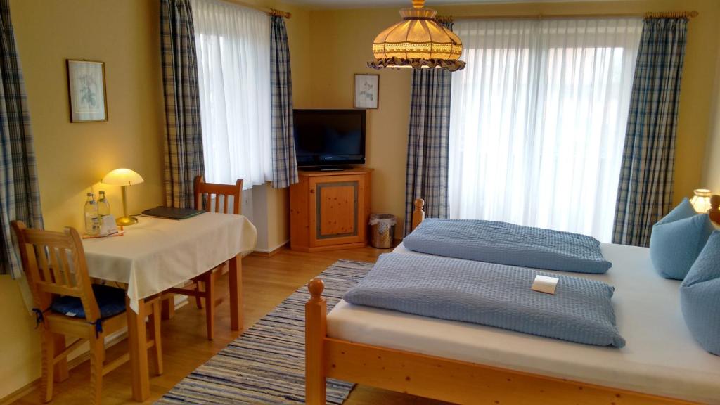 Postel nebo postele na pokoji v ubytování Hotel Unterwirt