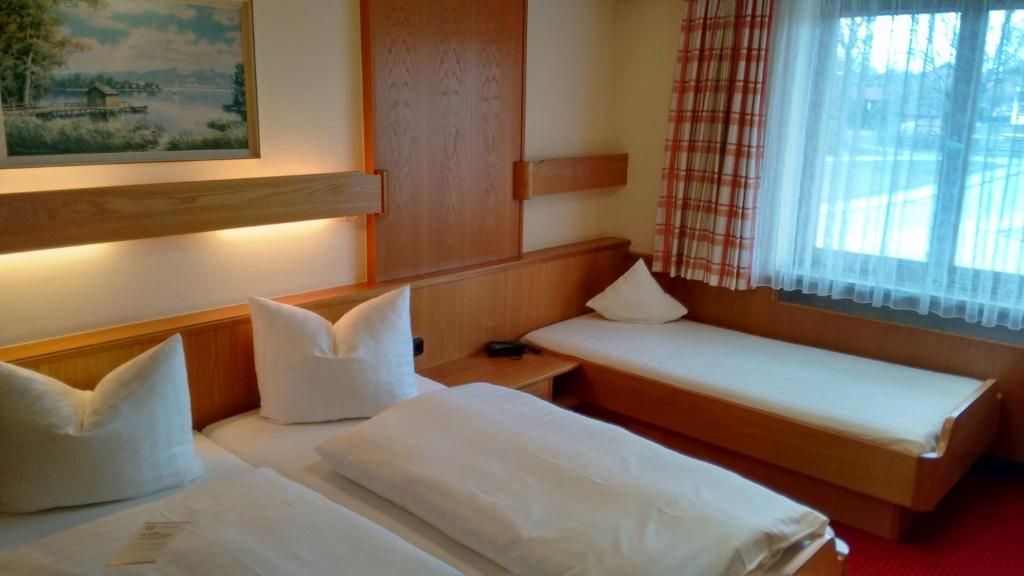 Postel nebo postele na pokoji v ubytování Hotel Unterwirt