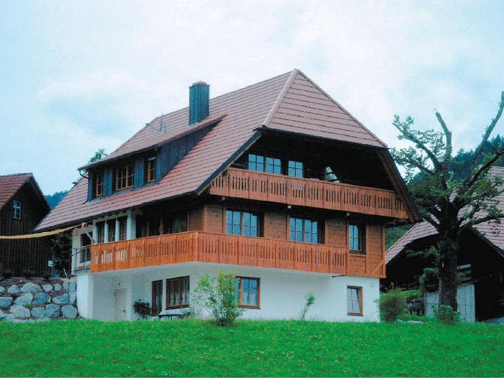 a large wooden house with a gambrel roof at Oberrainbauernhof in Gutach