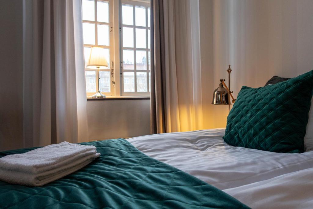 Postel nebo postele na pokoji v ubytování Furunäset Hotell & Konferens
