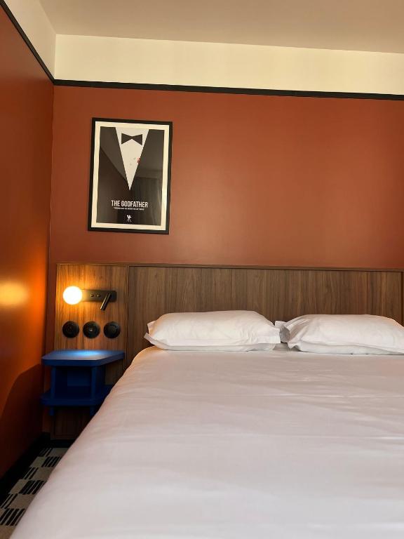 Postel nebo postele na pokoji v ubytování Hotel Le Lumière